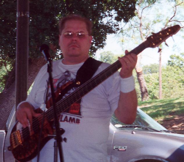 Shouldn't David Be Playing the Guitar Instead of Taking Pictures?